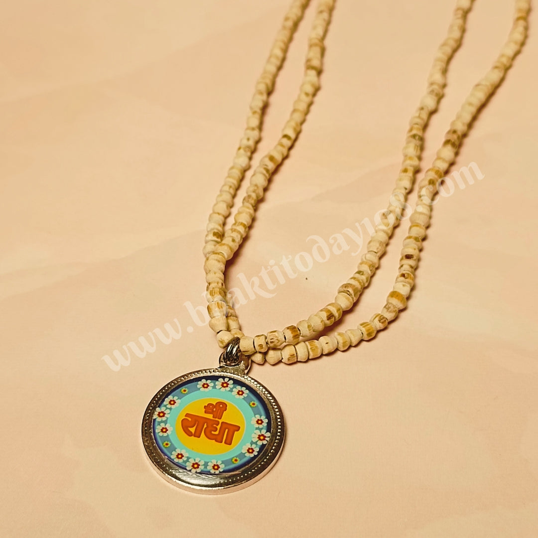 Handcrafted Radha Naam Tulsi Mala with pure Tulsi beads from Vrindavan and Radha Naam engraved locket, offering spiritual protection, divine love, and blessings.