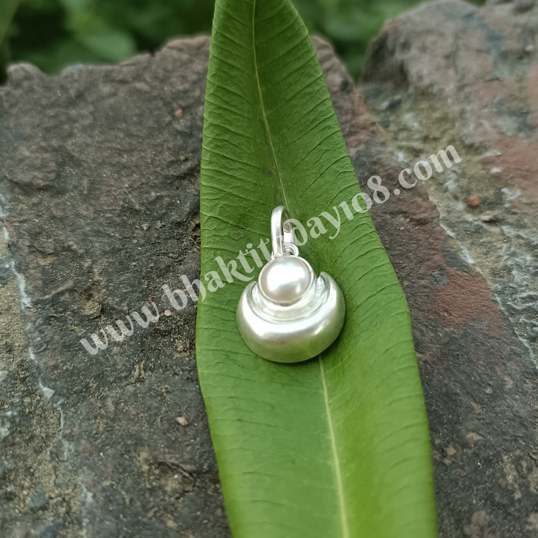 Elegant pure silver pearl locket with intricate design, showcasing a timeless blend of grace and purity.
