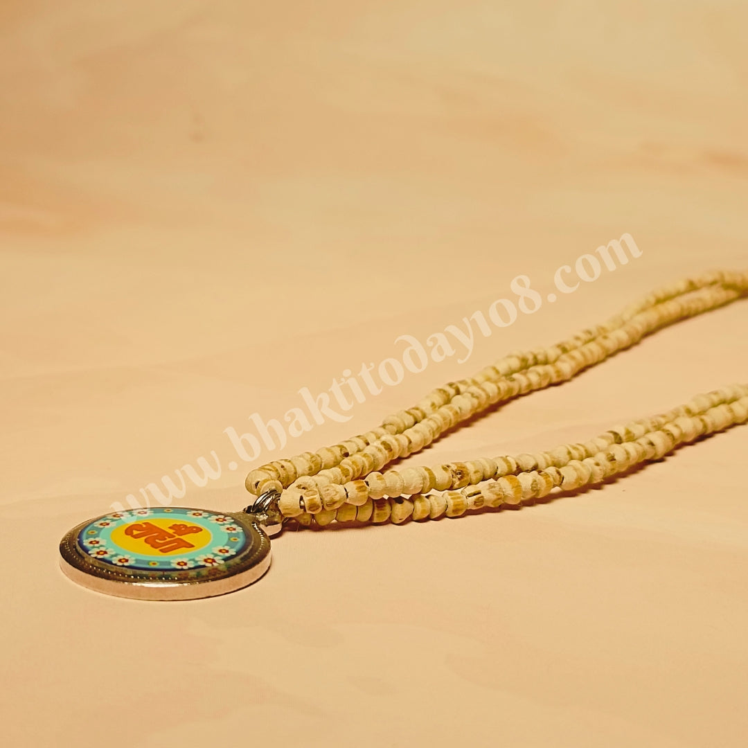 Handcrafted Radha Naam Tulsi Mala with pure Tulsi beads from Vrindavan and Radha Naam engraved locket, offering spiritual protection, divine love, and blessings.