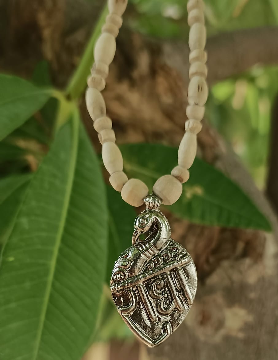 Handcrafted Radha Naam Tulsi Mala with pure Tulsi wood beads and Radha Naam engraved locket, offering spiritual protection, devotion, and blessings from Vrindavan.