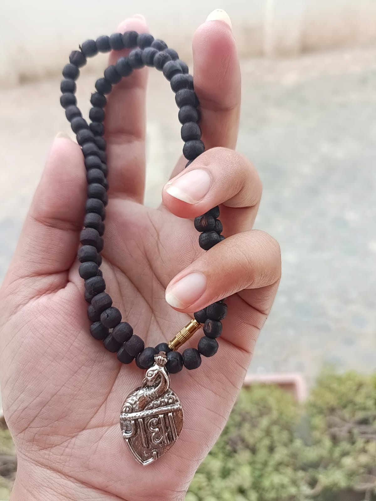 Radha Naam Tulsi Mala with stainless steel locket and pure Tulsi beads handcrafted in Vrindavan – spiritual necklace for peace, protection, and devotion.