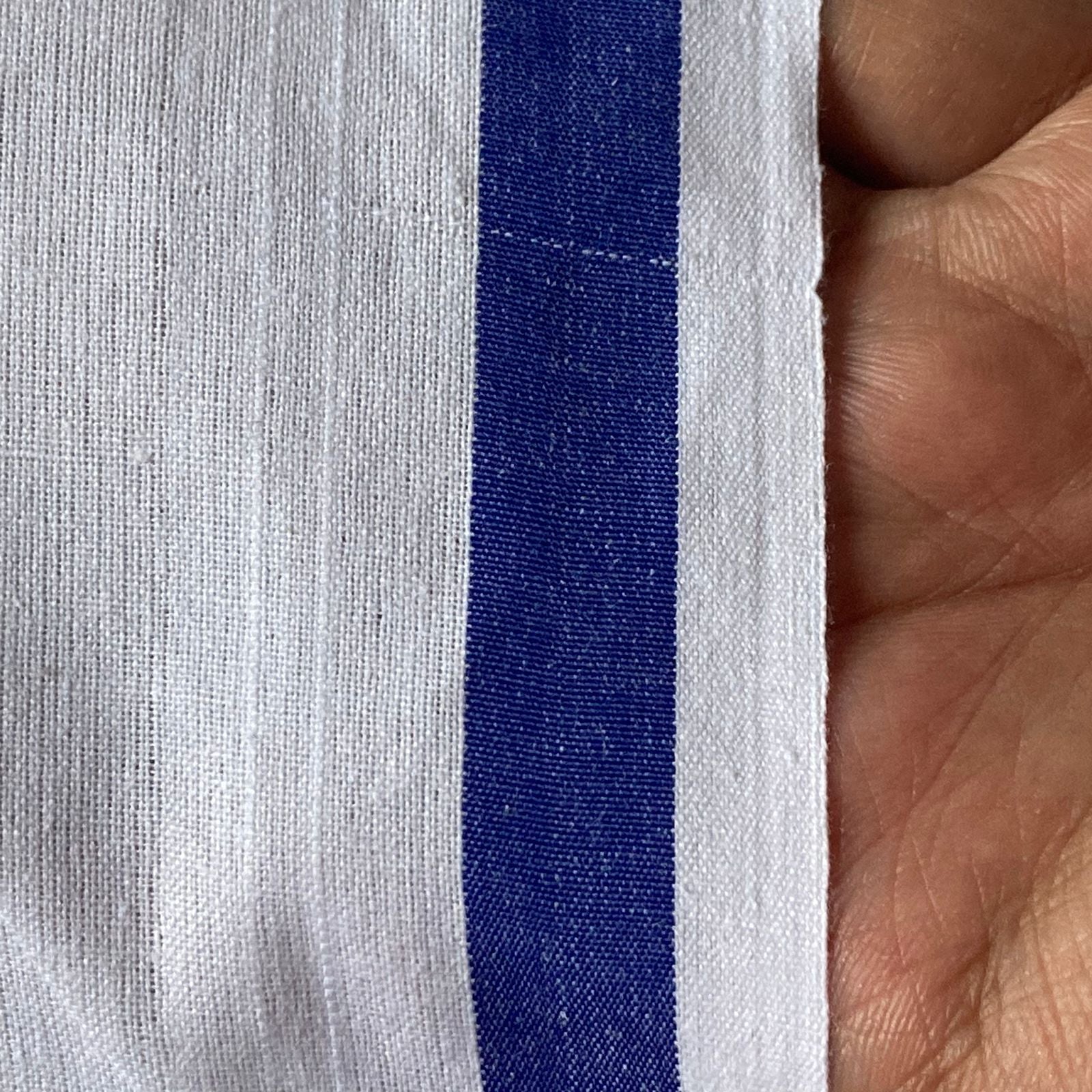 Traditional men's cotton dhoti made from soft, breathable fabric, featuring a simple and elegant design ideal for religious ceremonies, festivals, or everyday ethnic wear.