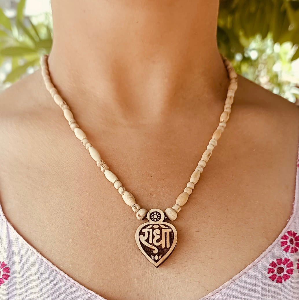 Handcrafted Radha Naam Tulsi Mala with pure Tulsi beads and Radha locket, offering spiritual protection, devotion, and divine love from Vrindavan.